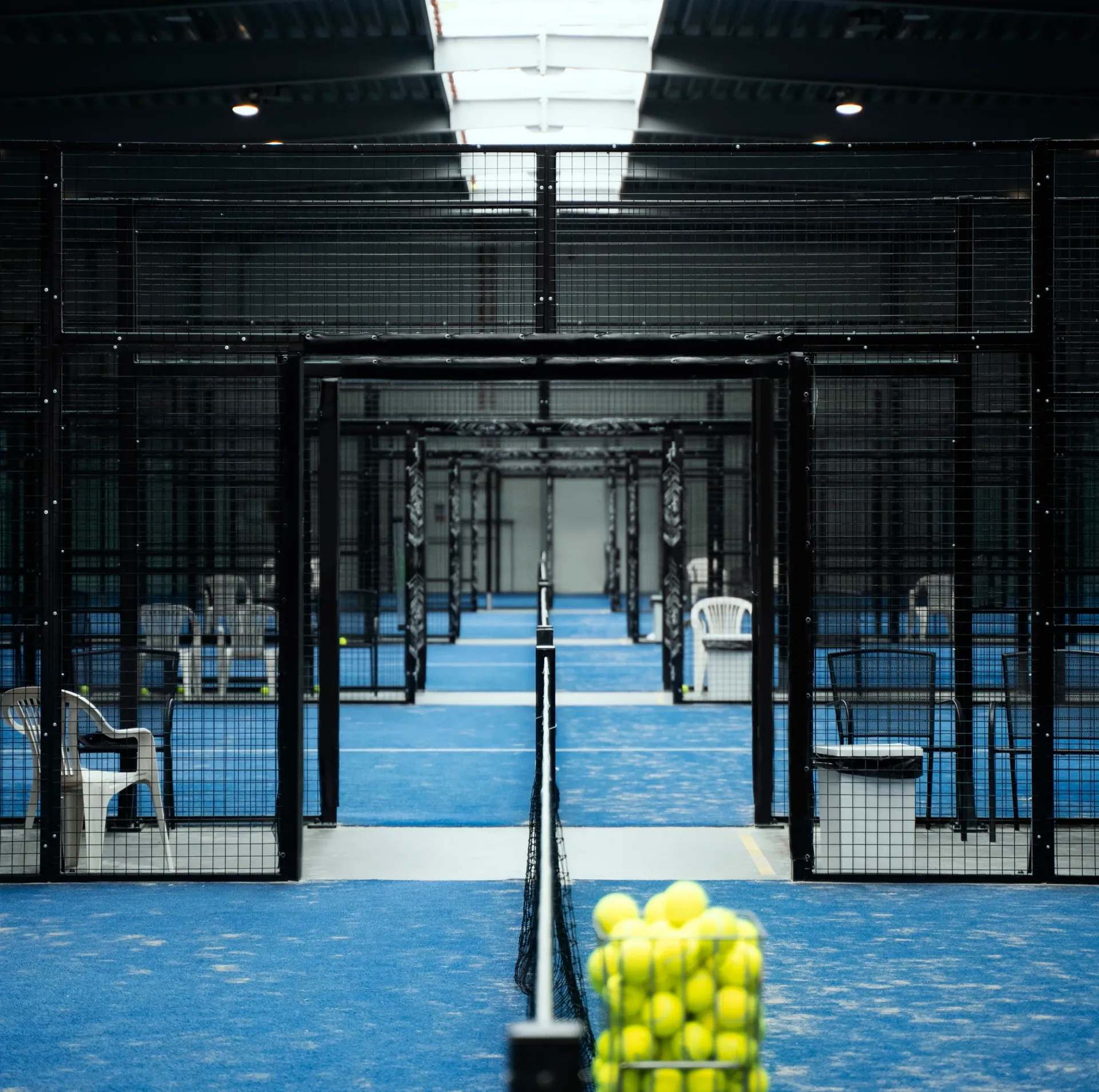 Professional padel court construction team working on premium court installation